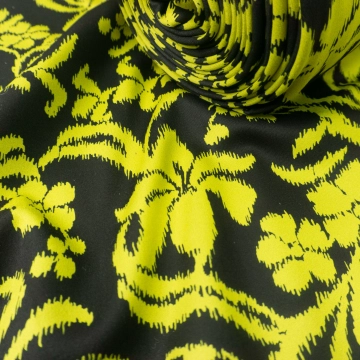 Трикотаж плотный желтый икат на темно-коричневом